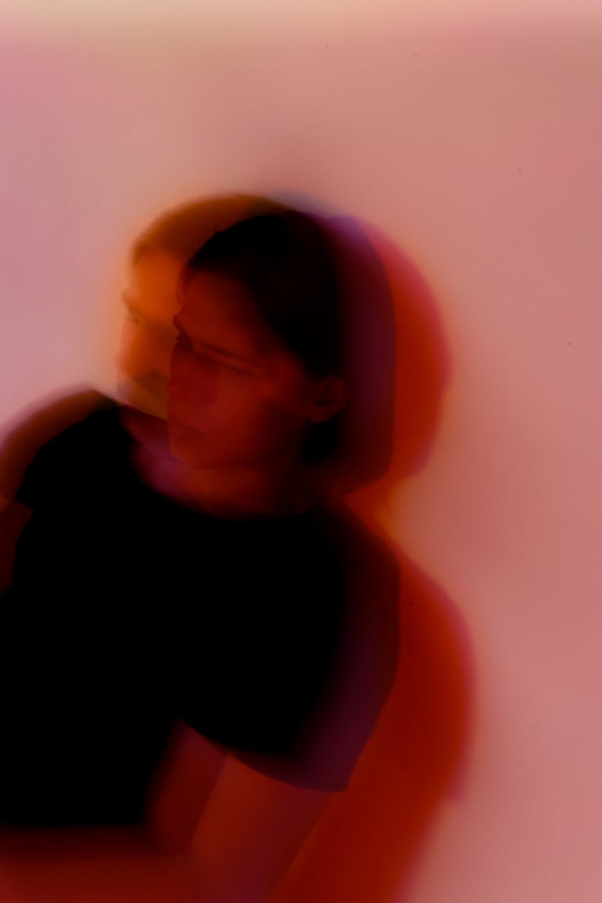 unrecognizable man with mental disorder near wall